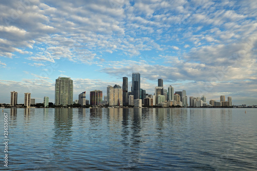 Miami  Florida 11-24-2018 The skyline of the City of Miami  Florida  reflected in the calm water of Biscayne Bay in early morning light.