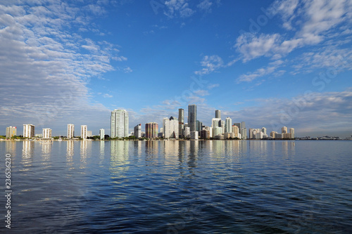 Miami, Florida 11-24-2018 The skyline of the City of Miami, Florida, reflected in the calm water of Biscayne Bay in early morning light.
