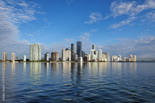 Miami  Florida 11-24-2018 The skyline of the City of Miami  Florida  reflected in the calm water of Biscayne Bay in early morning light.