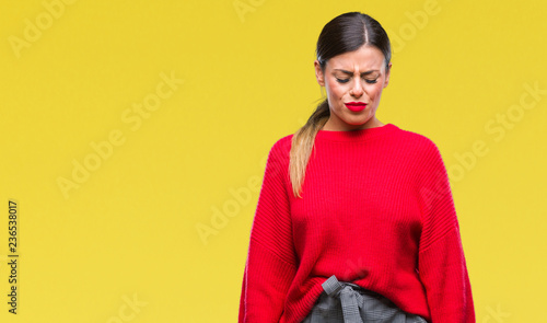Young beautiful business woman wearing winter sweater over isolated background depressed and worry for distress, crying angry and afraid. Sad expression.