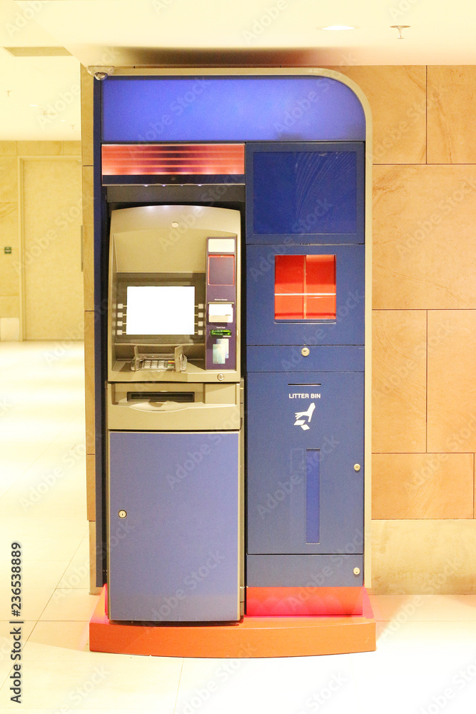 ATM Machine standing on Brick wall, Monetary Operations Concept ATM Machine standing on Brick wall, Monetary Operations Concept