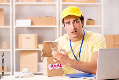 Handsome contractor working in box delivery relocation service 