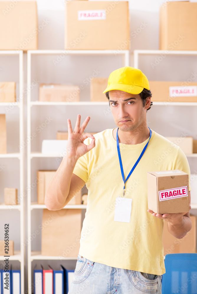 Handsome contractor working in box delivery relocation service 