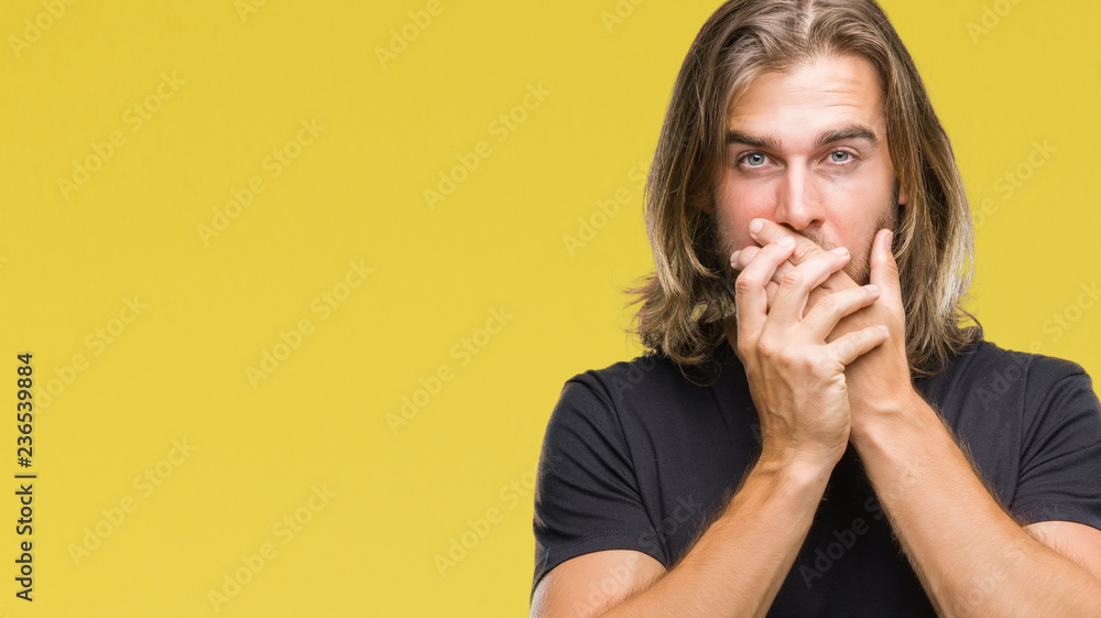 Young handsome man with long hair over isolated background shocked covering mouth with hands for mistake. Secret concept. Young handsome man with long hair over isolated background shocked covering mouth with hands for mistake. Secret concept.