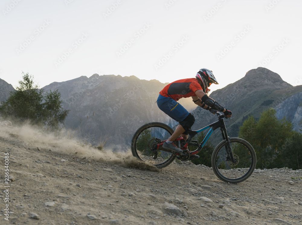Man freeriding with high speed downhill alpine singletrack Man freeriding with high speed downhill alpine singletrack