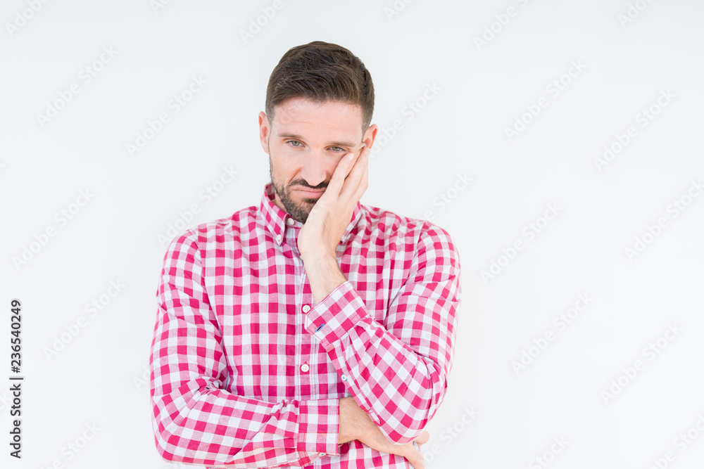 Young handsome man wearing shirt over isolated background thinking looking tired and bored with depression problems with crossed arms. Young handsome man wearing shirt over isolated background thinking looking tired and bored with depression problems with crossed arms.