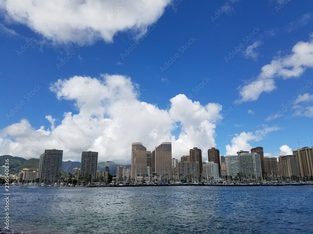 Skyline of Waikiki and Diamond Head during day with yachts and boats in Ala Moana harbor