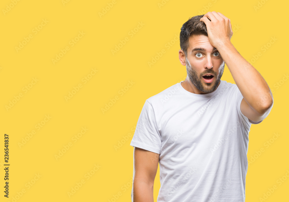 Young handsome man over isolated background surprised with hand on head for mistake, remember error. Forgot, bad memory concept. Young handsome man over isolated background surprised with hand on head for mistake, remember error. Forgot, bad memory concept.