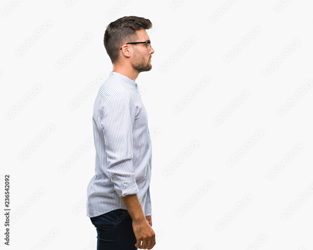 Young handsome man over isolated background looking to side, relax profile pose with natural face with confident smile. Young handsome man over isolated background looking to side, relax profile pose with natural face with confident smile.