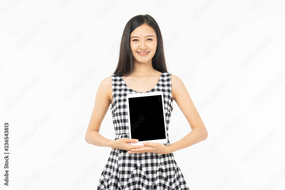 smiling beautiful asian woman holding tablet computer isolated on a white background. smiling beautiful asian woman holding tablet computer isolated on a white background.