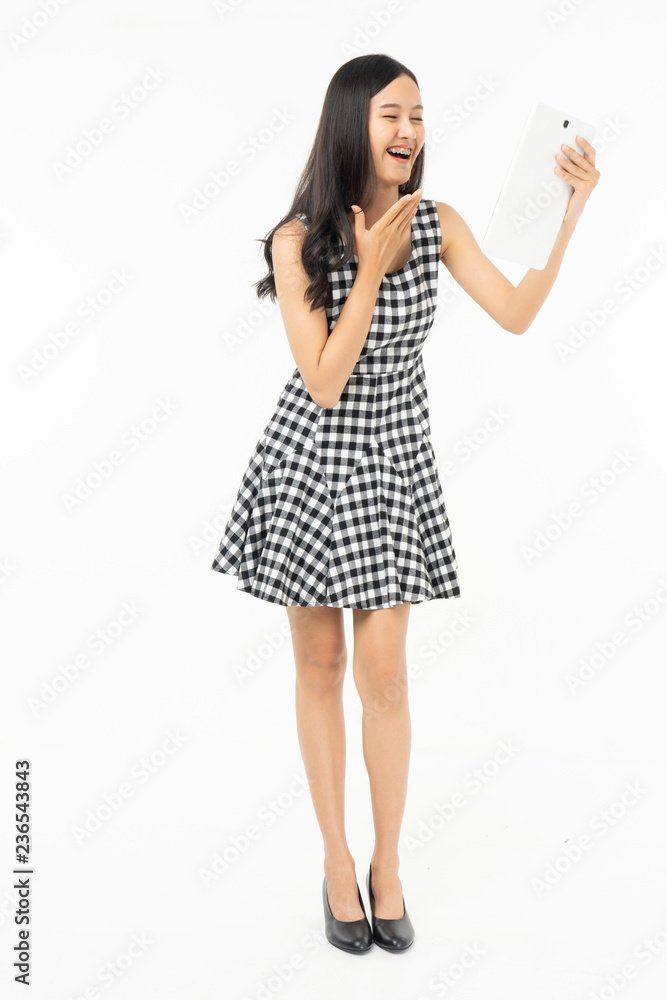 smiling beautiful asian woman holding tablet computer isolated on a white background. smiling beautiful asian woman holding tablet computer isolated on a white background.