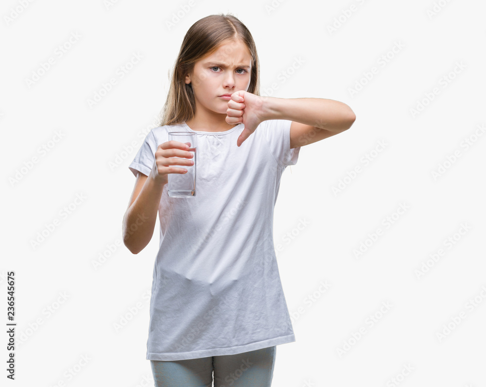 Young beautiful girl drinking glass of water over isolated background with angry face, negative sign showing dislike with thumbs down, rejection concept Young beautiful girl drinking glass of water over isolated background with angry face, negative sign showing dislike with thumbs down, rejection concept
