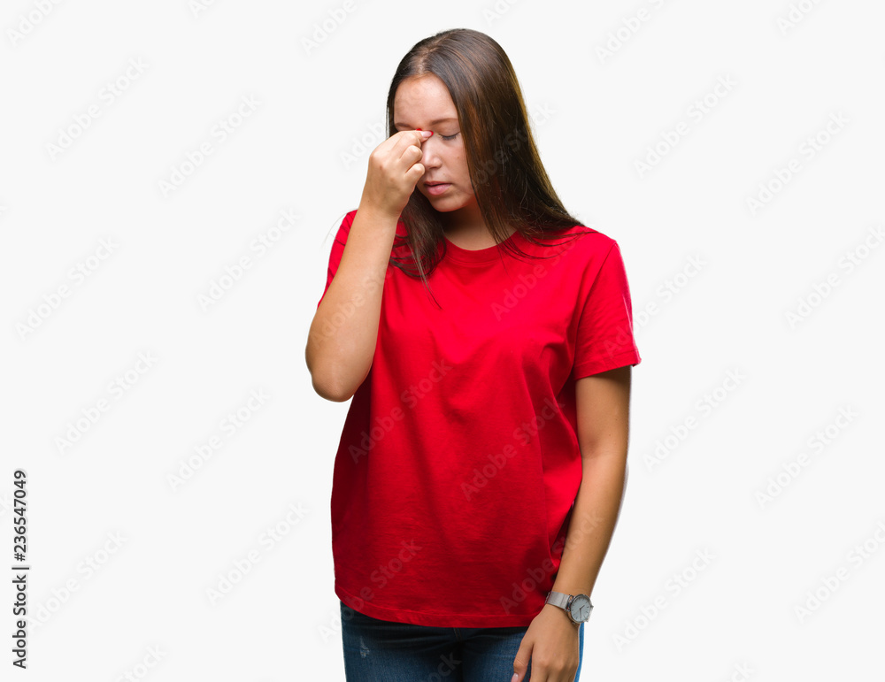 Young beautiful caucasian woman over isolated background tired rubbing nose and eyes feeling fatigue and headache. Stress and frustration concept. Young beautiful caucasian woman over isolated background tired rubbing nose and eyes feeling fatigue and headache. Stress and frustration concept.