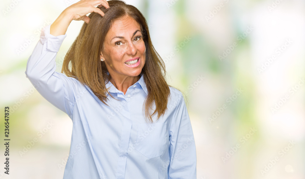Beautiful middle age business adult woman over isolated background confuse and wonder about question. Uncertain with doubt, thinking with hand on head. Pensive concept. Beautiful middle age business adult woman over isolated background confuse and wonder about question. Uncertain with doubt, thinking with hand on head. Pensive concept.