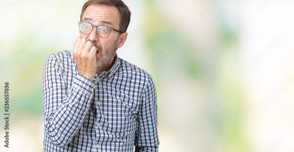 Handsome middle age elegant senior business man wearing glasses over isolated background looking stressed and nervous with hands on mouth biting nails. Anxiety problem. Handsome middle age elegant senior business man wearing glasses over isolated background looking stressed and nervous with hands on mouth biting nails. Anxiety problem.