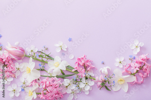 beautiful spring flowers on paper background photo