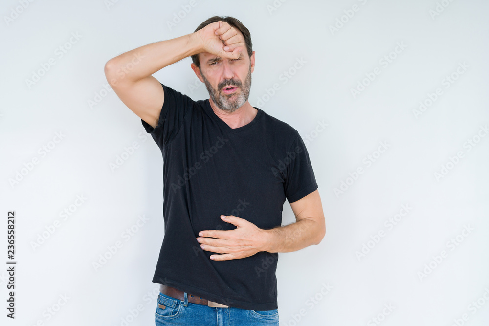 Senior man over isolated background Touching forehead for illness and fever, flu and cold, virus sick Senior man over isolated background Touching forehead for illness and fever, flu and cold, virus sick