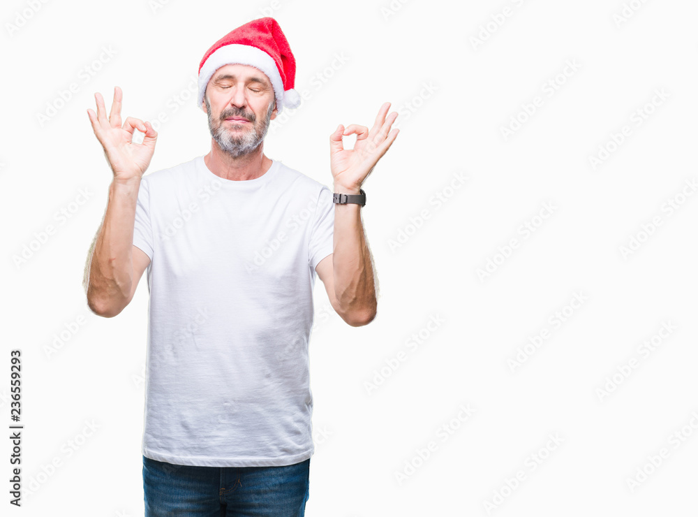 Middle age hoary senior man wearing christmas hat over isolated background relax and smiling with eyes closed doing meditation gesture with fingers. Yoga concept. Middle age hoary senior man wearing christmas hat over isolated background relax and smiling with eyes closed doing meditation gesture with fingers. Yoga concept.
