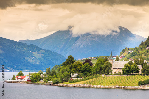 Mountains and fjord with village Norway. photo