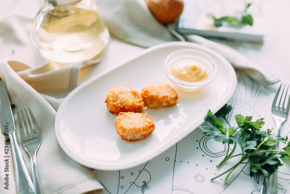 Chicken and cheese nuggets with sauce. Restaurant dishes with a beautiful serving. Chicken and cheese nuggets with sauce. Restaurant dishes with a beautiful serving.