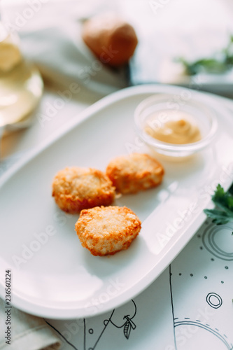 Chicken and cheese nuggets with sauce. Restaurant dishes with a beautiful serving.