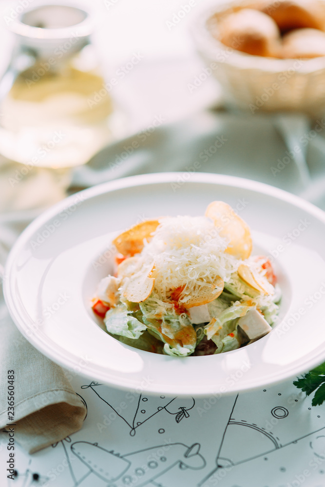 The Caesar salad and the classic shrimp. Restaurant dishes with a beautiful serving.