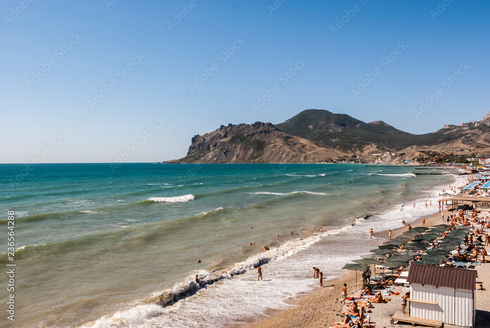 Crimea. Black Sea. Nude beach in Koktebel. View of the mountain Kara