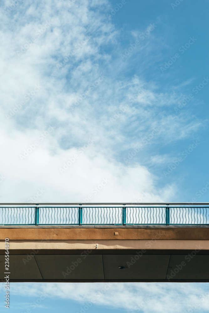 Detail of suspended bridge against a blue sky Detail of suspended bridge against a blue sky