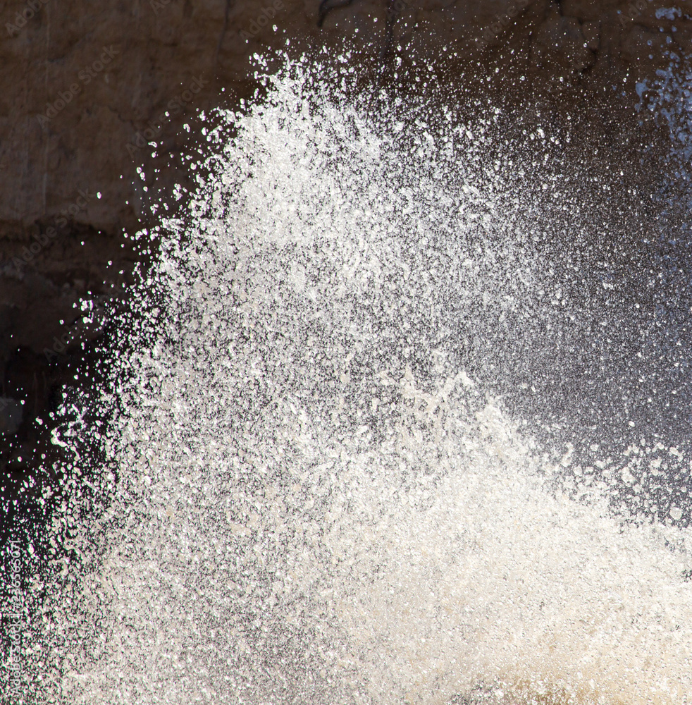 Splashes of dirty water on the surface of the river