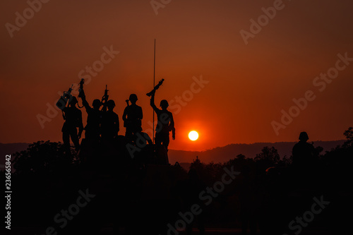 twilight landscape silhouette military and gun