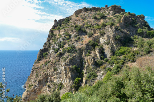 ruins of  medieval castle on the sea cliff near Guneykoy, Antalya, Turkey photo