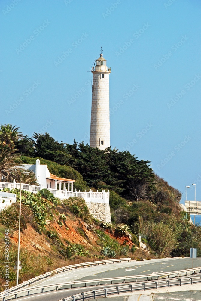 Elevated view of the lighthouse overlooking the A7/N340 coastal highway, El Faro, Mijas Costa, Spain.