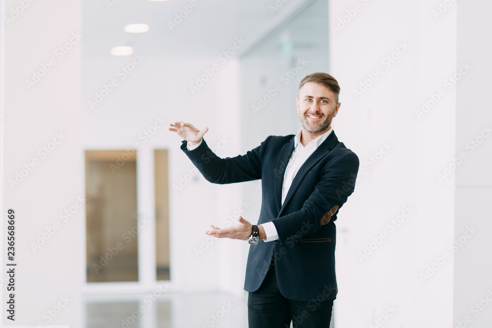 Businessman pointing and holding a palm up. The template for business design. Businessman pointing and holding a palm up. The template for business design.