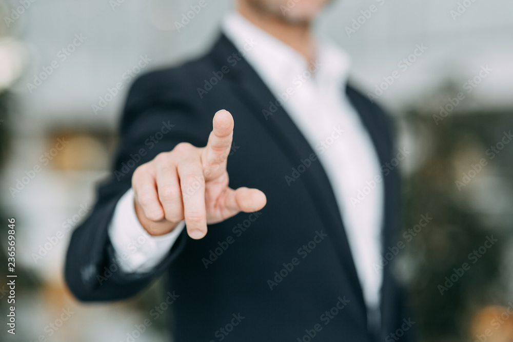 The businessman points his finger at the screen, presses and taps. Blank for the designer to hand. The businessman points his finger at the screen, presses and taps. Blank for the designer to hand.