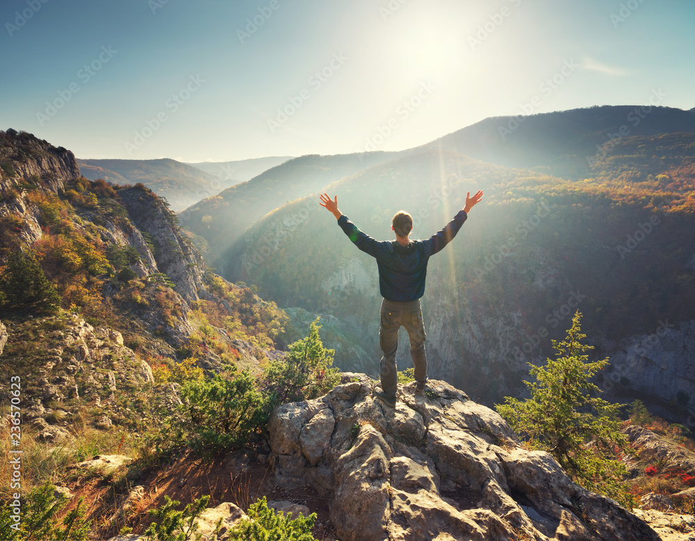 Man standing on the cliff in mountain. Man standing on the cliff in mountain.