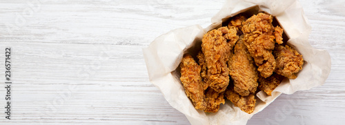 Tasty chicken wings, overhead view. Top view, from above. Copy space. photo