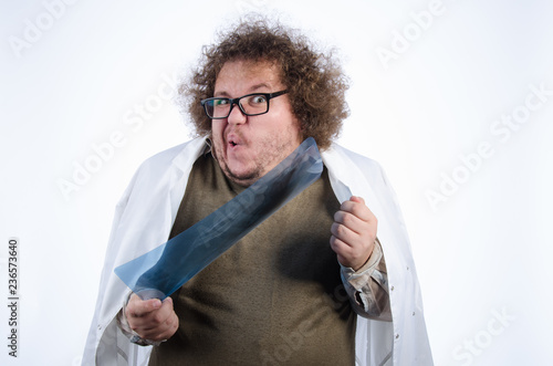 Funny fat doctor. White background. photo