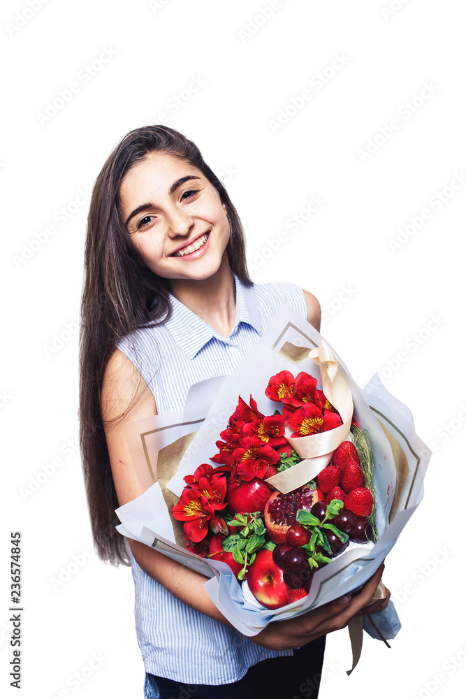 beautiful young girl holding large fruit bouquet in her hands and smiling beautiful young girl holding large fruit bouquet in her hands and smiling