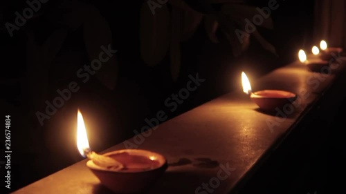 night dolly shot of hindu traditional oil lamp lights called diyo during hindu traditional festival dipawali photo