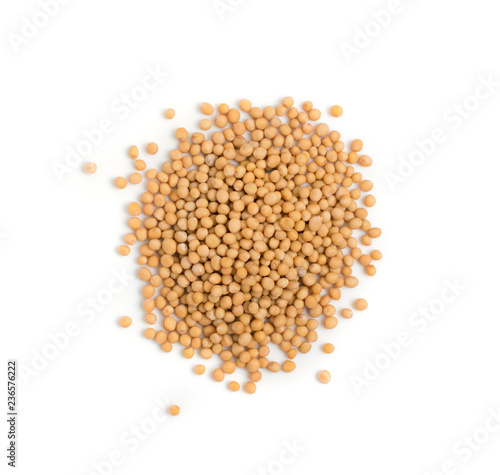 Dry yellow mustard seeds isolated on white background