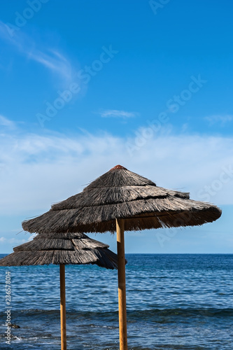 Two sun umbrellas on the beach