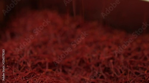 Saffron threads are raining down, a saffron pile is growing, Closeup