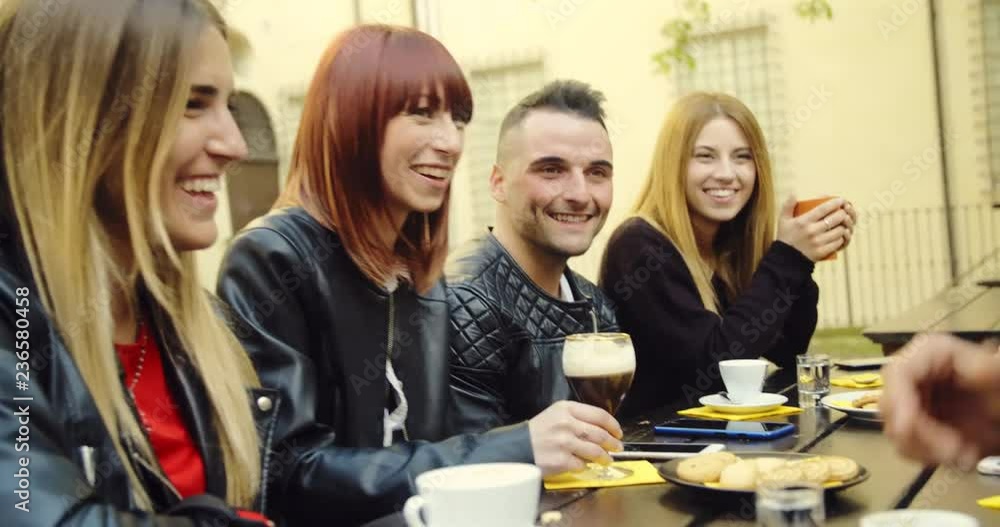 large group of friends in an outdoor cafeteria large group of friends in an outdoor cafeteria
