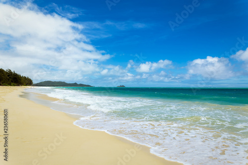 Beautiful Waimanalo beach with turquoise water and cloudy sky, Oahu coastline, Hawaii
