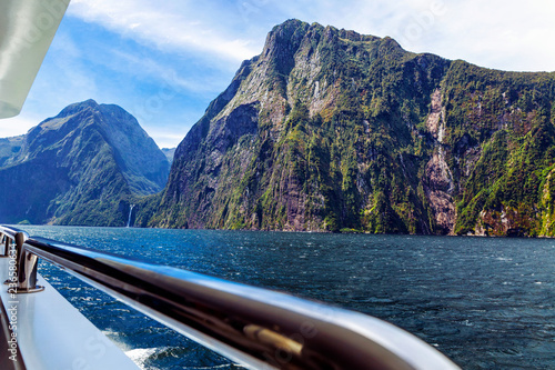 Rocky mountains and waterfall in Milford sound, image taken from cruise ferry