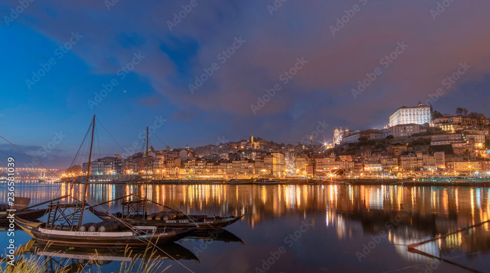 view of porto with rabeiro classic boat at sunset blu hour