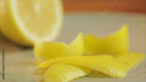 Lemon peel on a wooden table, wandering focus, Closeup.