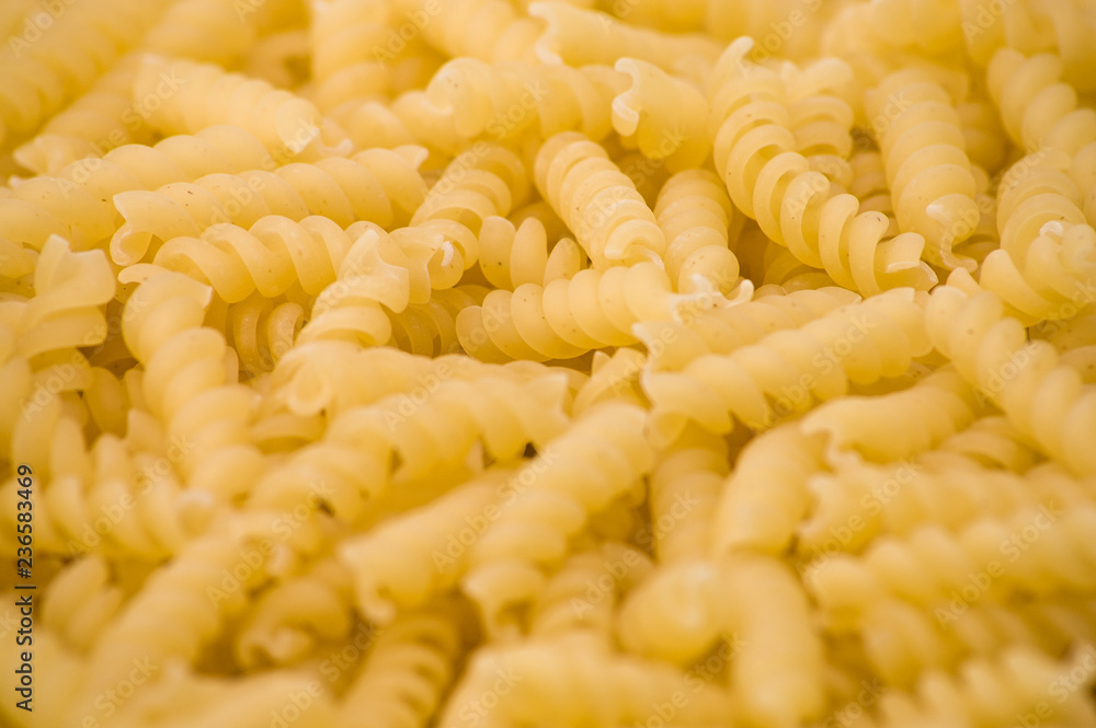 Food background, uncooked italian pasta, closeup Food background, uncooked italian pasta, closeup