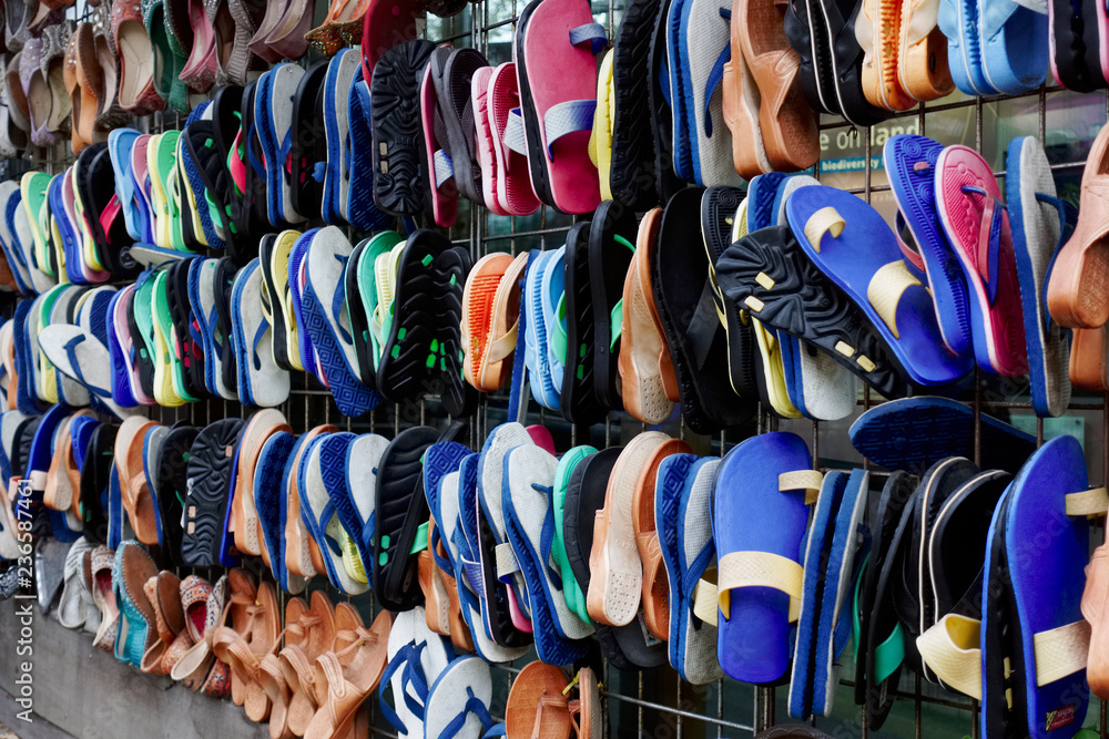 Sandles shoes flip flops hanging rows must colours in market India