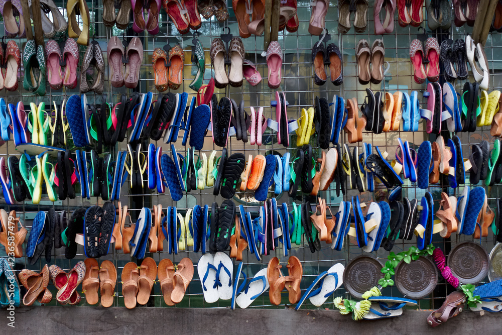 Sandles shoes flip flops hanging rows must colours in market India